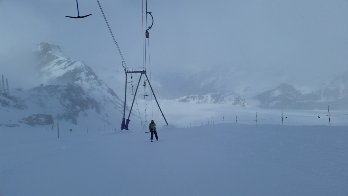 This was by far the longest poma lift I'd ever ridden. Because the tram was closed, we had to take this thing for like 30 minutes to get to the Italian side, which was completely foggy anyway, with wet snow to boot